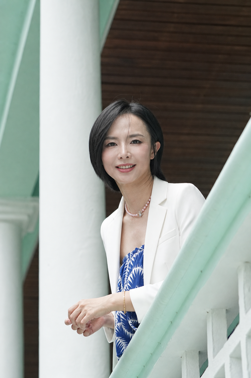 Kary Guo of Jinling Metals wearing a white blazer for the founder letter section