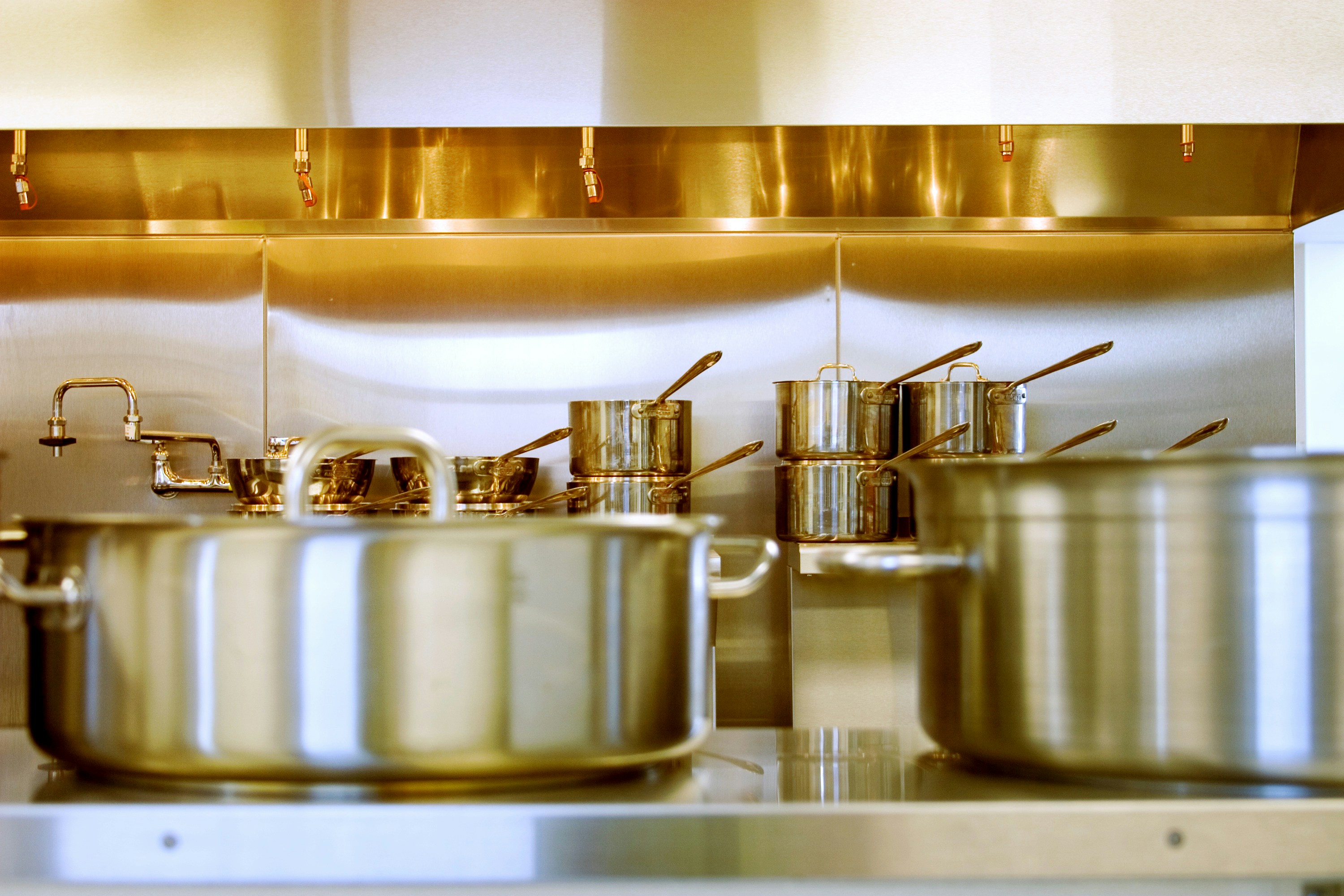 Food-contact stainless steel surfaces in beverage and kitchen processing equipment