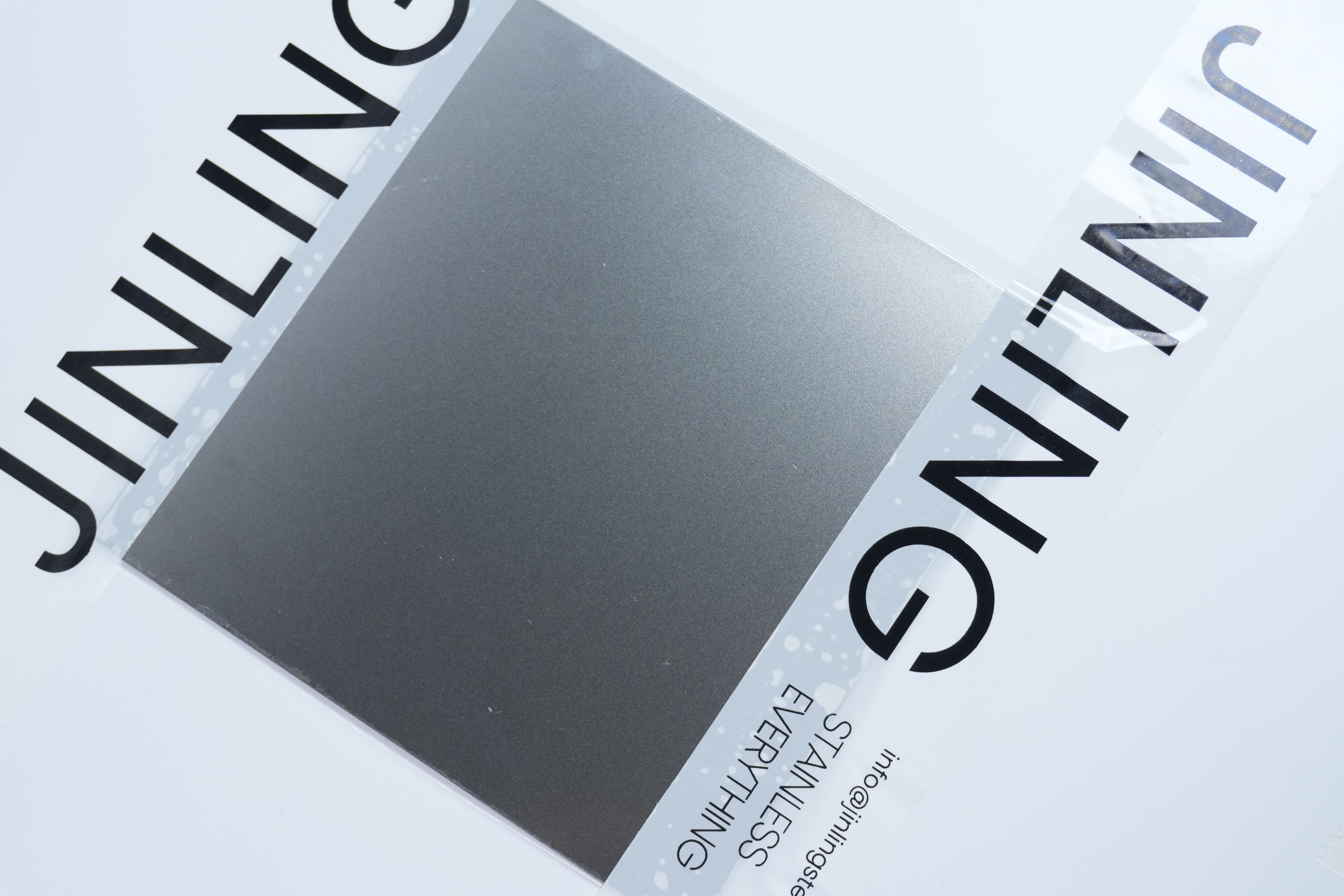 Hairline brushed stainless steel finish with directional grain